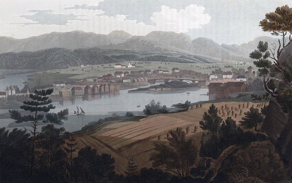 Utsikt over Skien anno 1800. Bybebyggelse med jordbruk i forkant og i bakgrunnen. Maleri. 