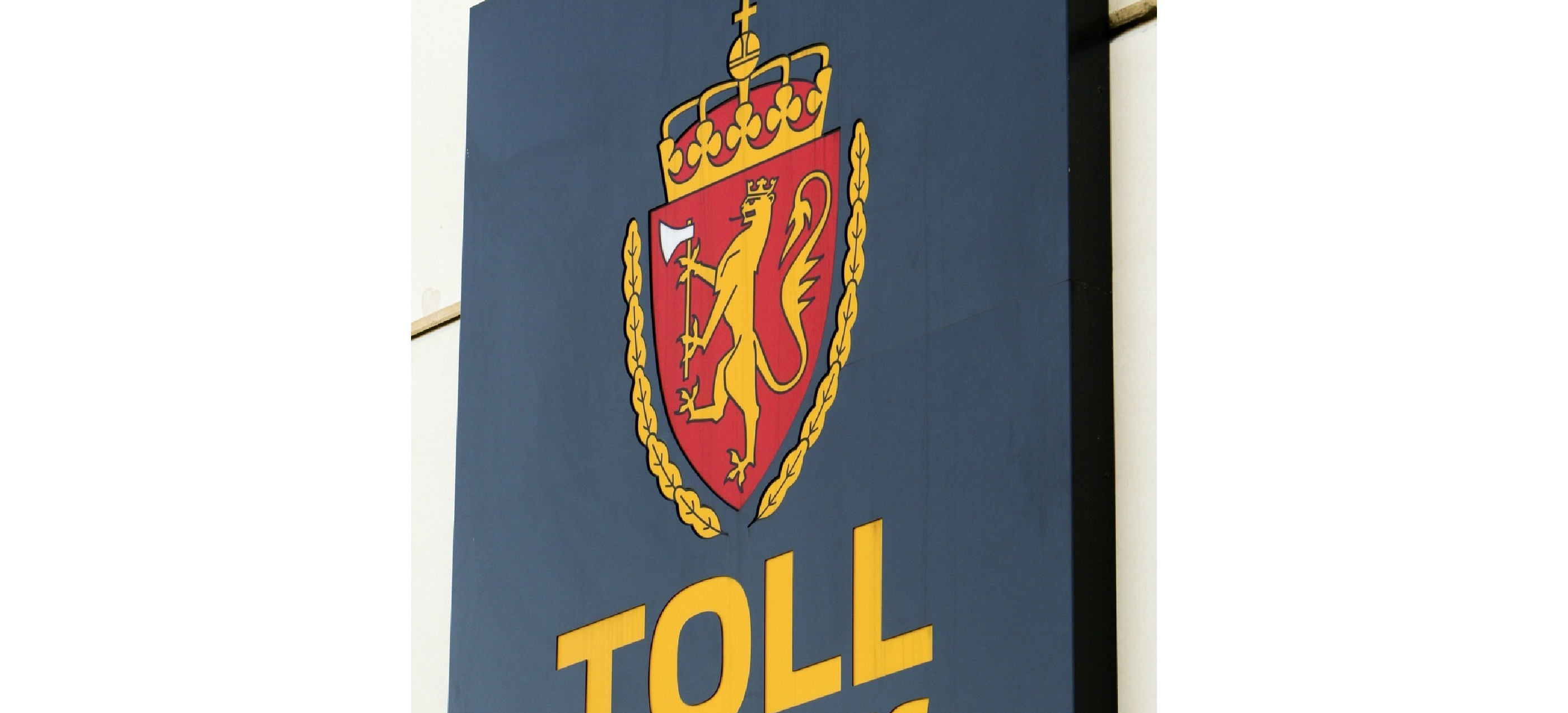 Skilt med logoen til Tolletaten. Foto.