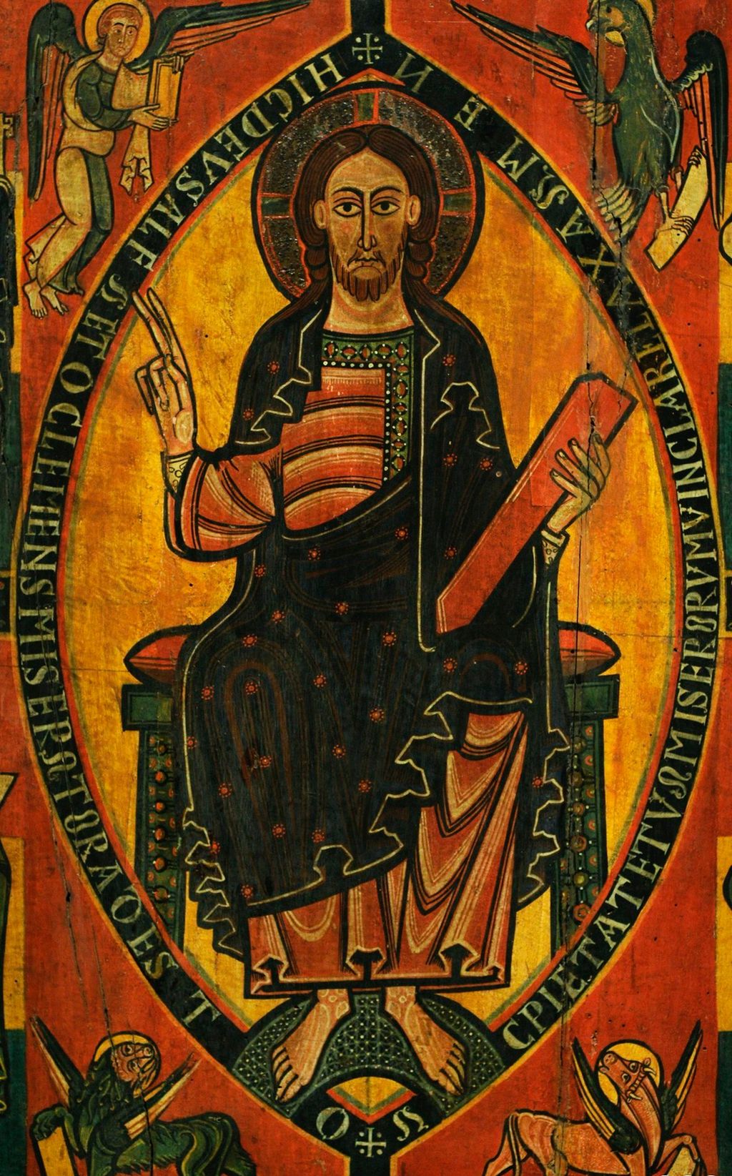 Jesus holder en bok i den ene hånden og holder opp to fingre med den andre. Rundt hodet er en glorie. Han er omgitt av tekst og fire ulike figurer. Maleri.