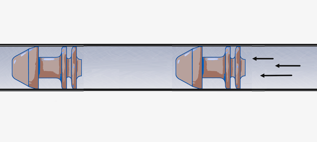 Plugger med gummioverflate pumpes gjennom en brønn. Disse pluggene kalles pigger. Illustrasjon.