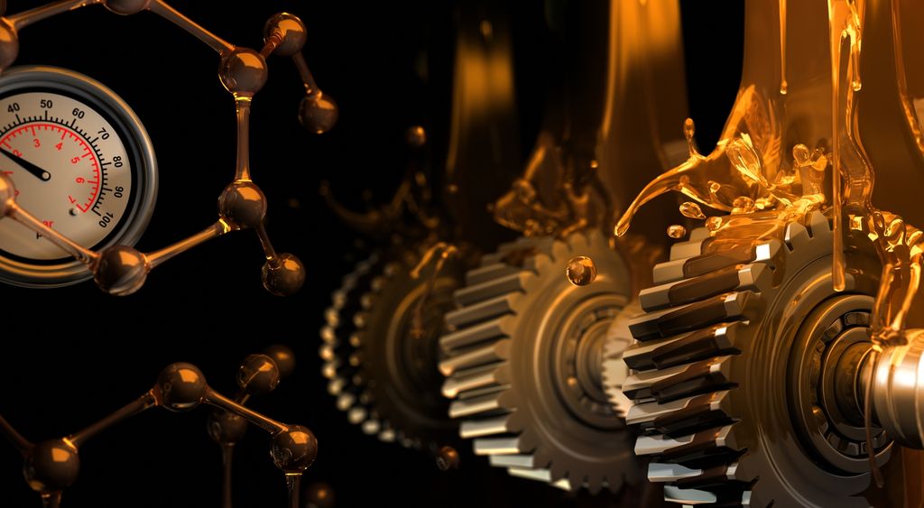 Smøremiddel drypper ned på maskin. Foto.