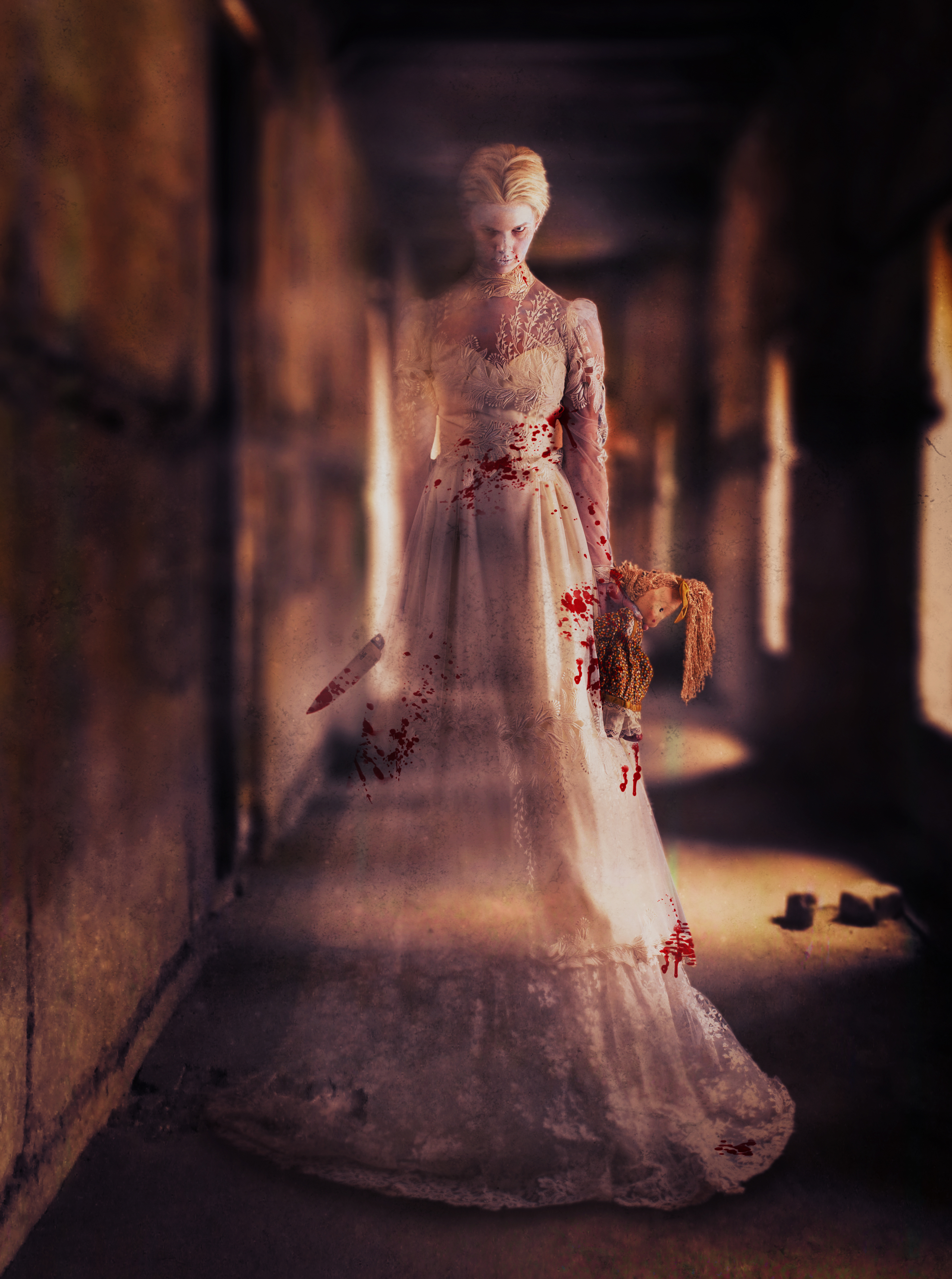 A blonde woman in a wedding dress. She is partly transparent. She is carrying a doll and a knife. Photo.