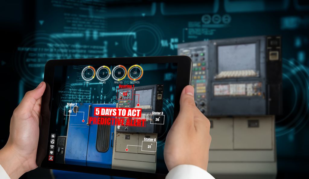 Person bruker nettbrett med AR-programvare i en fabrikk. På skjermen står det 5 days to act. Foto.