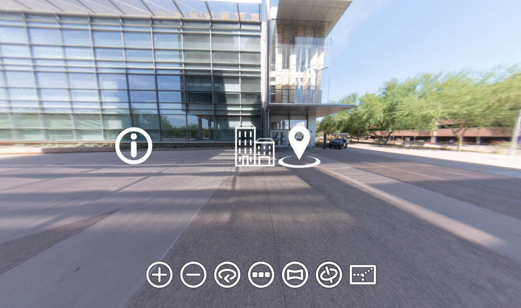 Piktogrammer for navigering er lagt over et bilde av et universitet. Foto. 