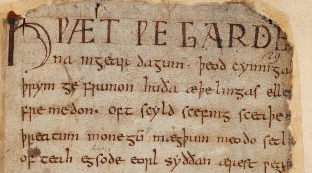 A page of parchment with writing on it. The letters and language is not like modern-day English. Photo.