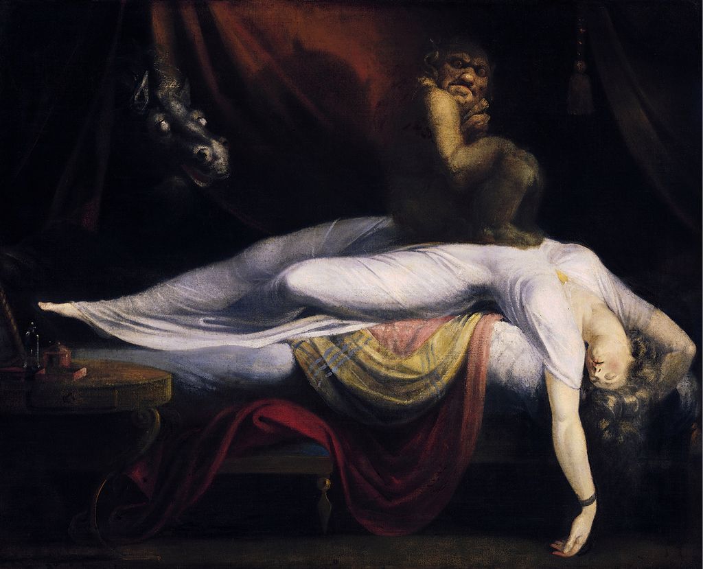 A woman wearing a white dress is lying on a bed, her arms above her head, she seems unconscious. On her chest a dark creature is sitting. In the background is a horse's head. Painting.