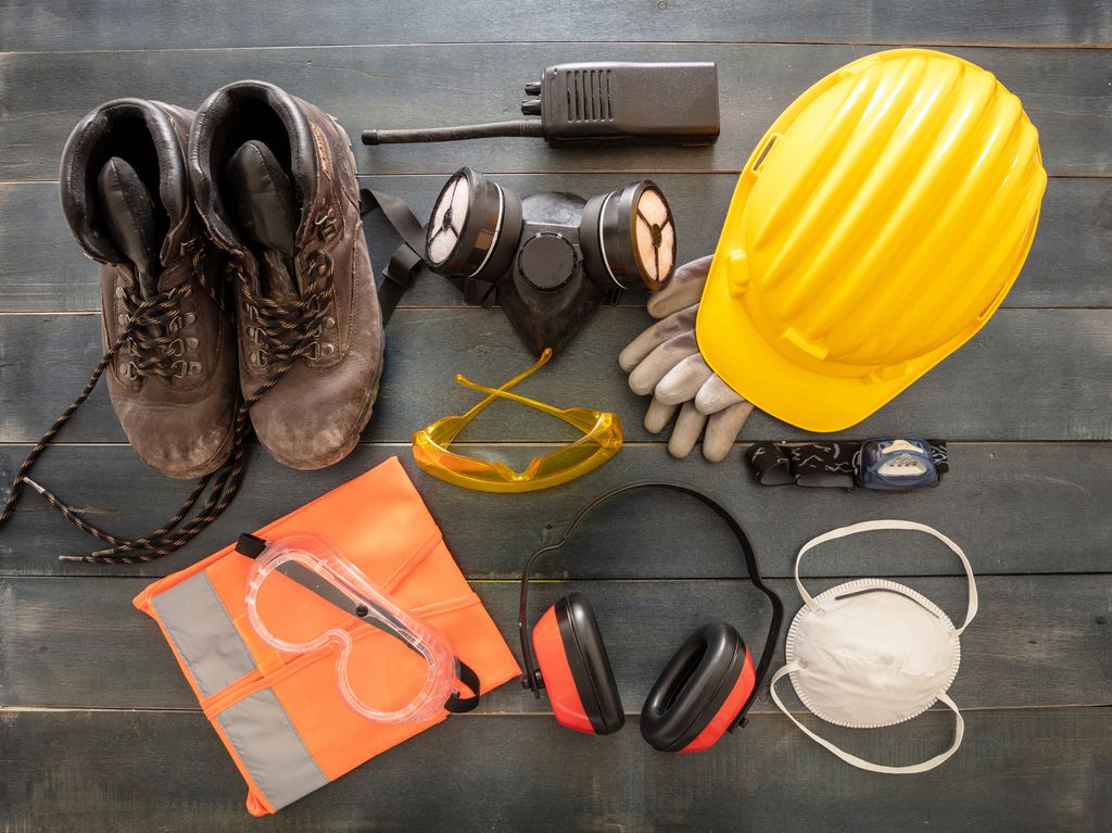 Protective shoes, goggles, high visibility vest, mask, hearing protection and more. Photo.