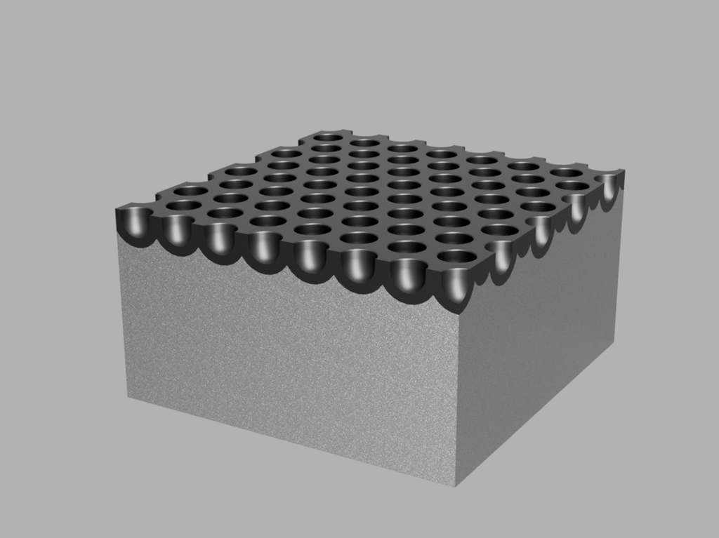 Rektangulær kloss med mange grunne hull i overflata. Illustrasjon.