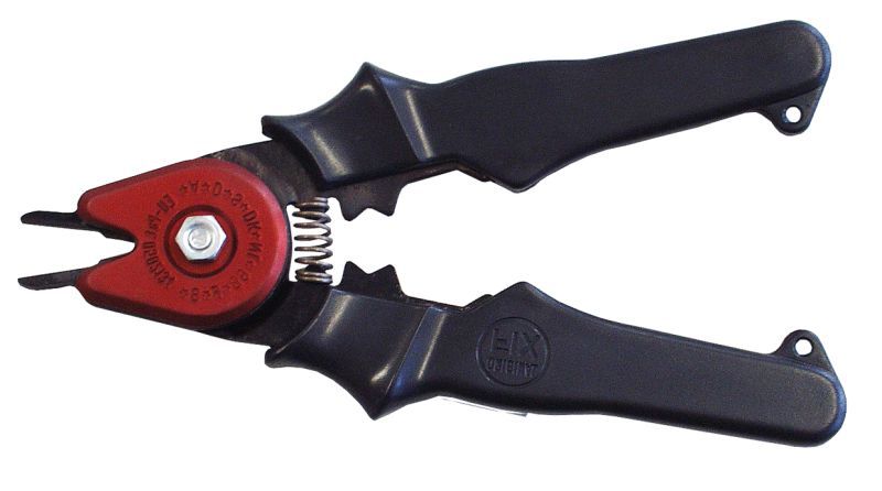 Svart sveisetong med raudt hovud. Foto.