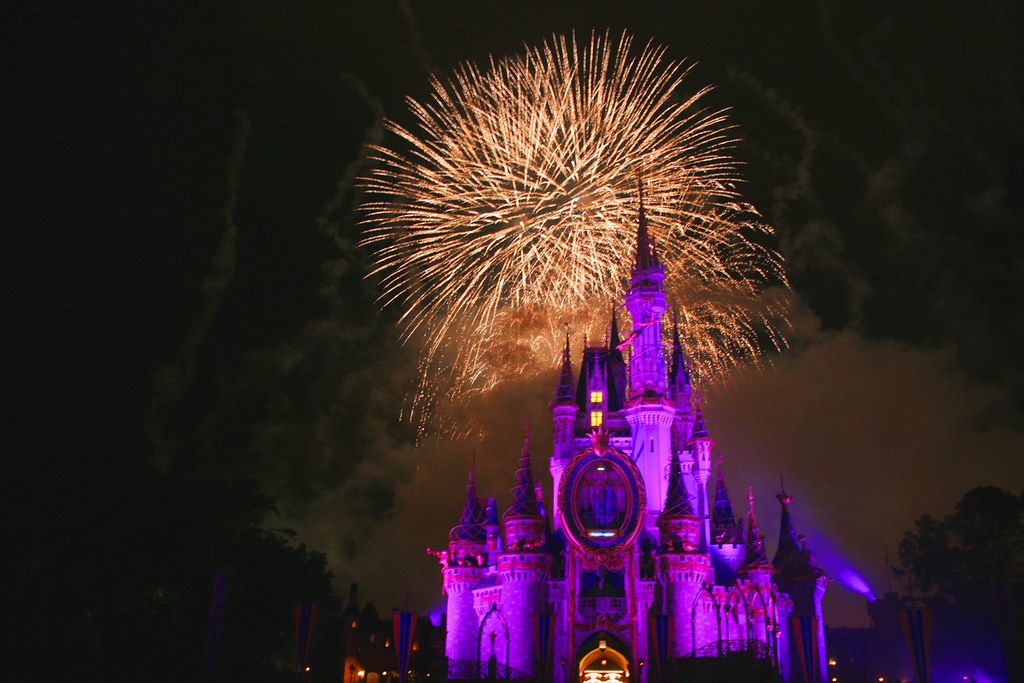 Cindarella's Castle in Walt Disney World with the IllumiNation firework in the background. Photo.