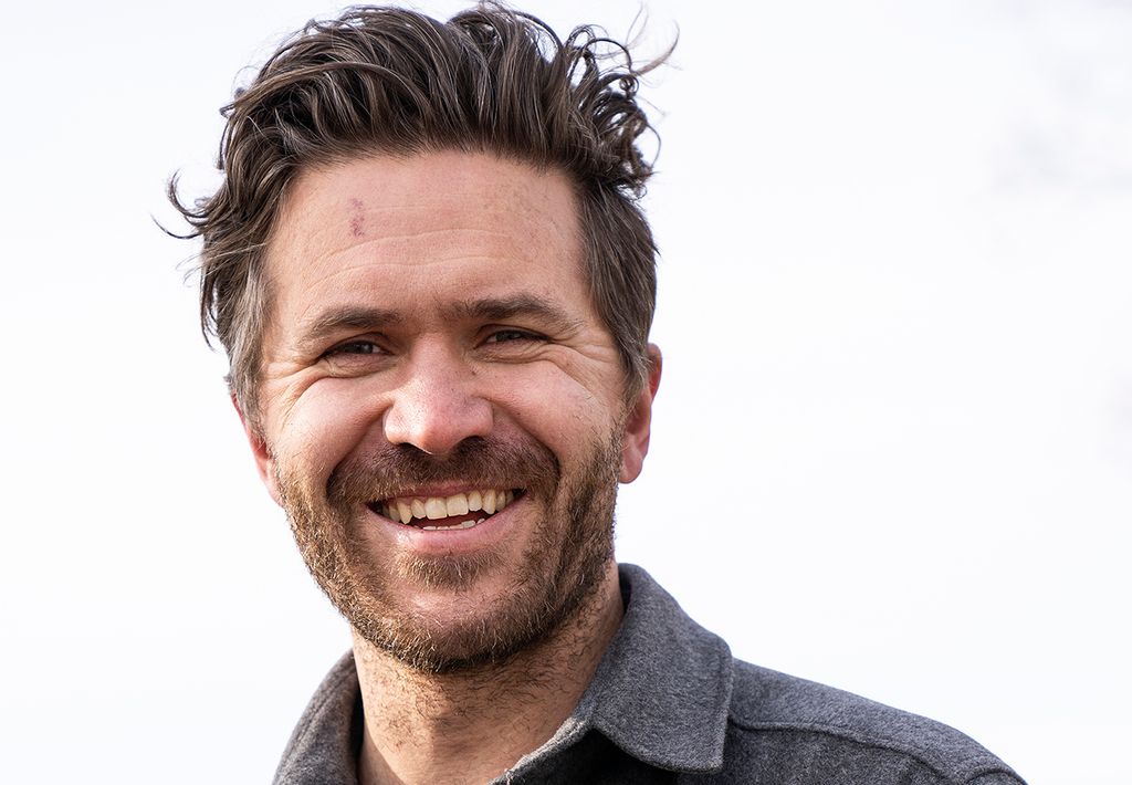 Jo Egil Tobiassen som smiler til kamera. Foto.