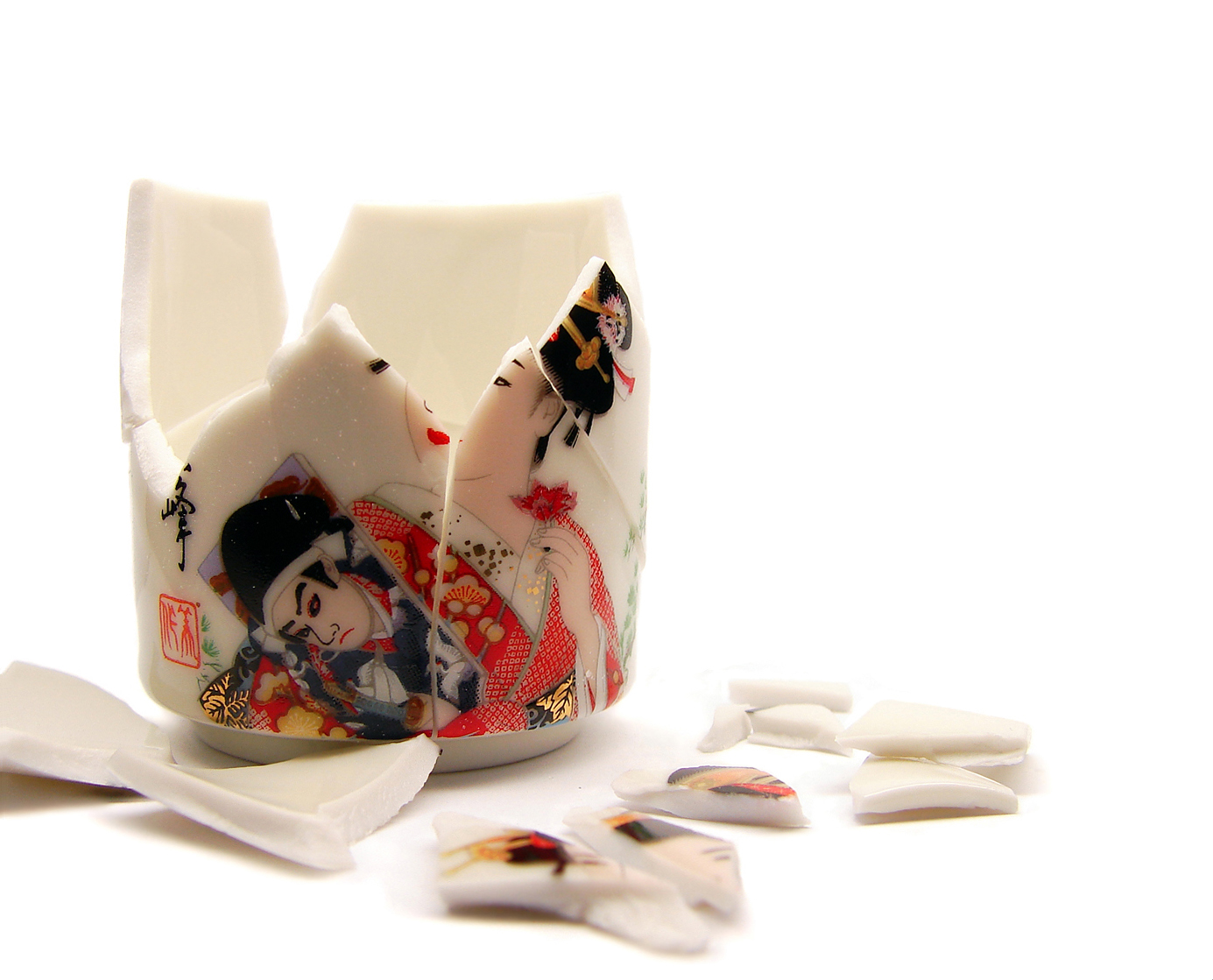 Japanese procelain cup without handle is broken. Photo.