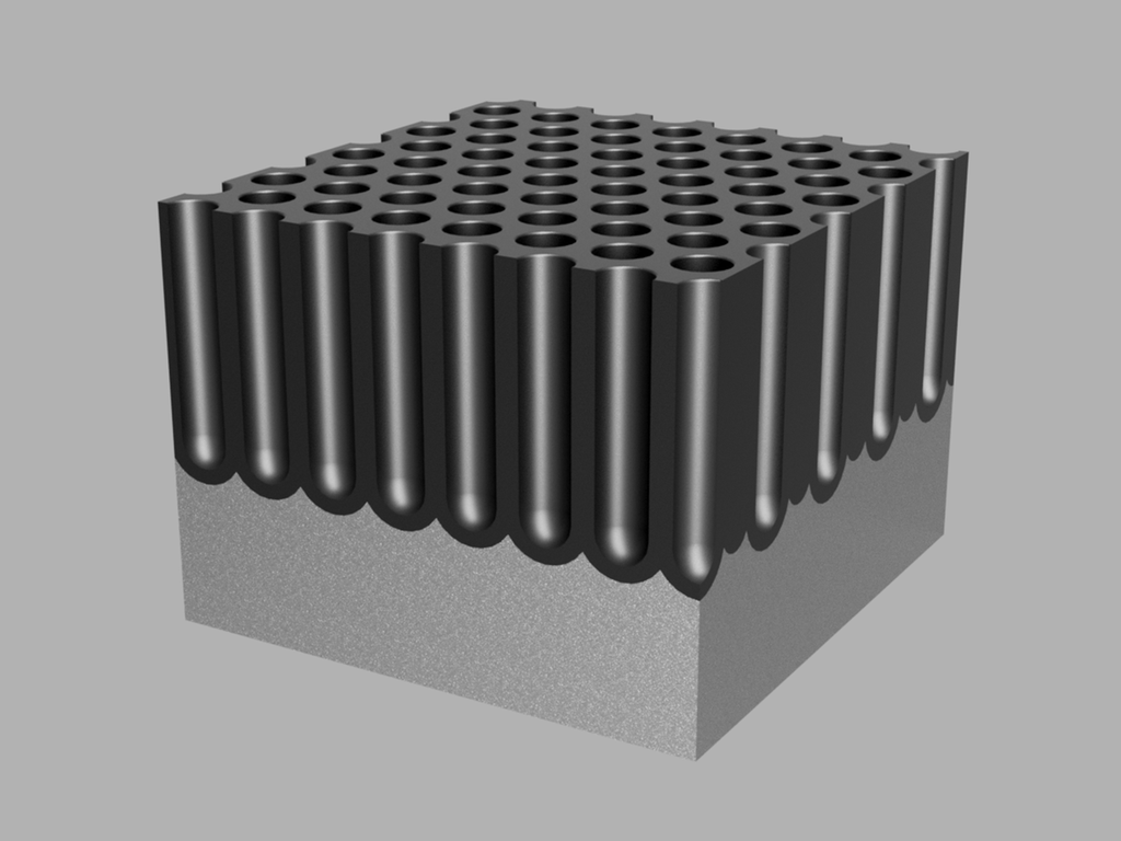 Rektangulær kloss med mange svært dype hull i overflata. Illustrasjon.