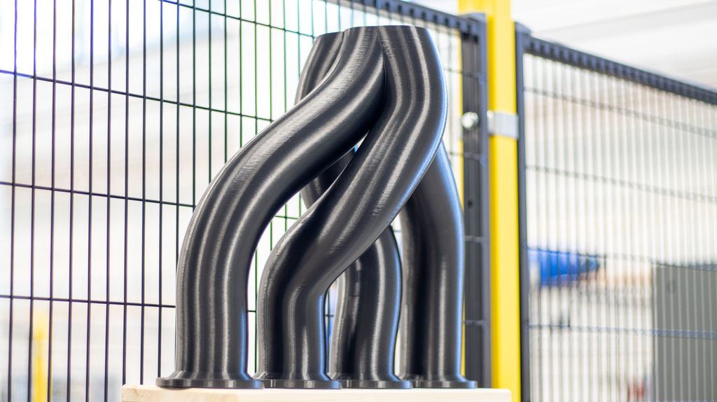 3D-printa del, der fire rør går sammen til ett rør. Foto.
