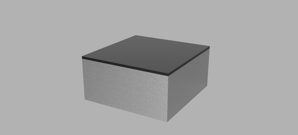 En firkanta kloss der oversida er farga mørk, mens resten er lysegrå. Illustrasjon.