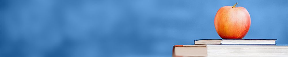 Bokstabel med eple på. Foto.