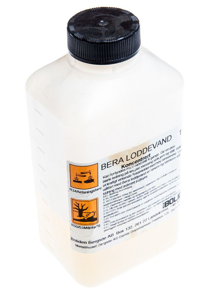 Flaske med loddevann. Foto.