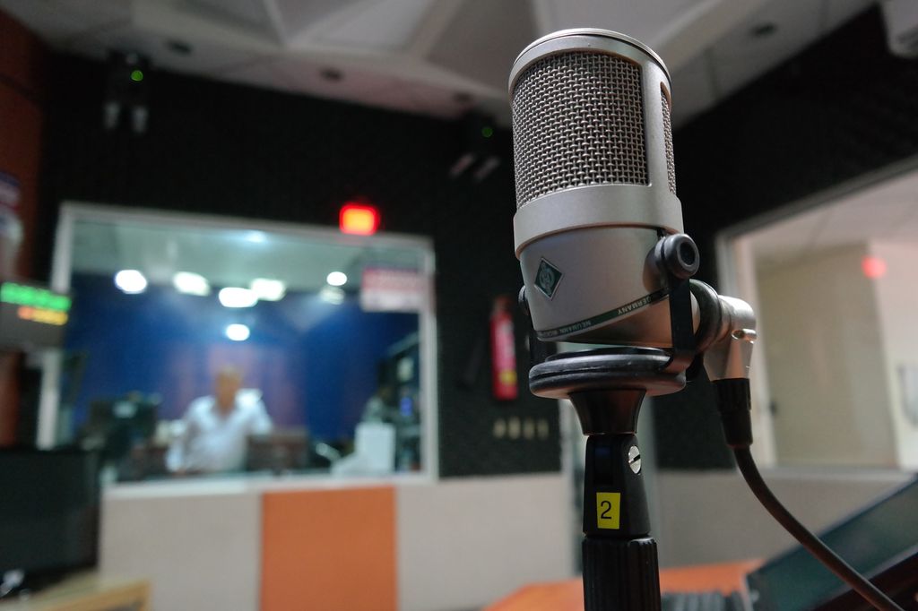 A microphone in a recording studio. Photo.
