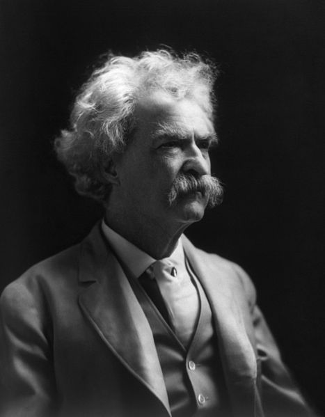 Mark Twain, an older man with bushy white hair, eyebrows and moustache. Photo.