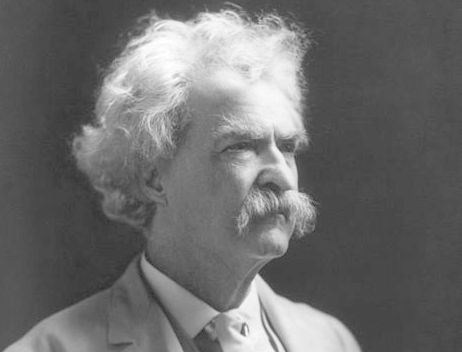 Mark Twain, an older man with bushy white hair, eyebrows and moustache. Photo.