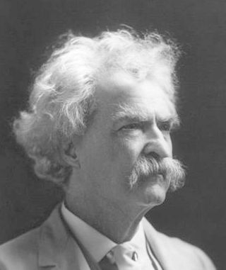 Photograph of Mark Twain. He is an older man with bushy white hair, eyebrows, and moustache.
