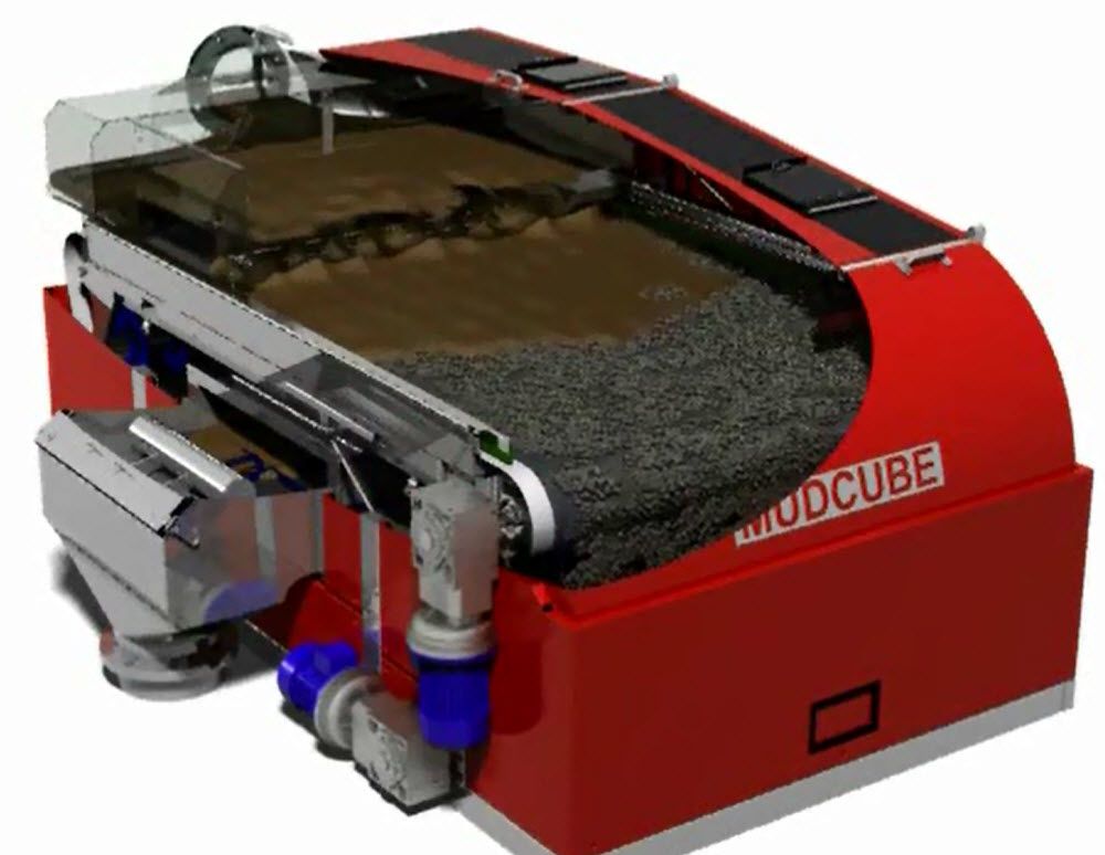 Bildet viser en mudcube, som er illustrert delvis åpen slik at vi kan se innvending. Der ser vi slam som siktes over filtrene i maskinen. Illustrasjon.