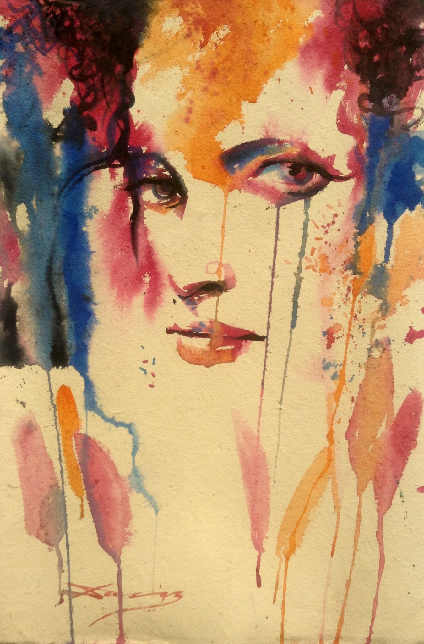 Watercolour painting: We see the outlines of a female face. There are lots of colours. 