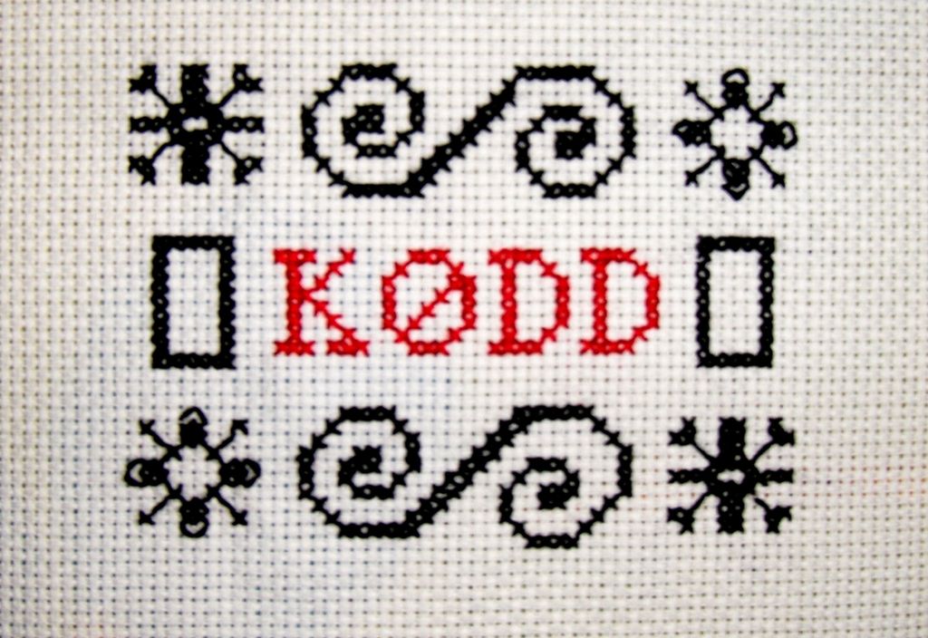 Et broderi av KØDD. Foto.