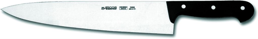 En kokkekniv mot hvit bakgrunn. Foto.