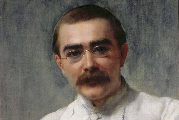 Painting: Portrait of Rudyard Kipling. We see a man in his late twenties. He has brown hair, bushy eyebrows and a large moustache. He wears gold-rimmed spectacles. He wears a white shirt.