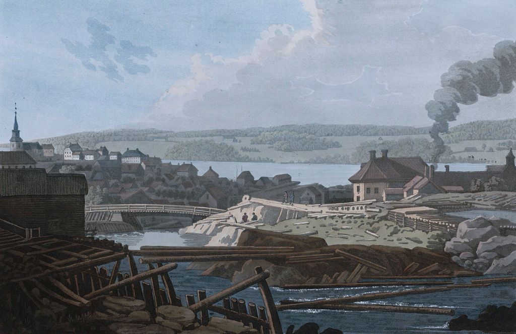 Mossefossen med tømmer på elva i forgrunnen. Røyk fra Moss Jernverk. Bebyggelse og kirke i bakgrunnen. Trykk fra cirka 1800.