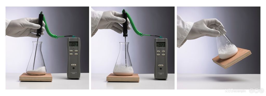 Måling av temperatur i hvitt stoff i erlenmeyerkolbe. Foto