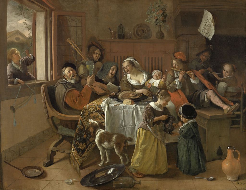 Oljemåleri av eit kaotisk måltid der ein familie skåler og speler instrument mens dei et.  Foto.