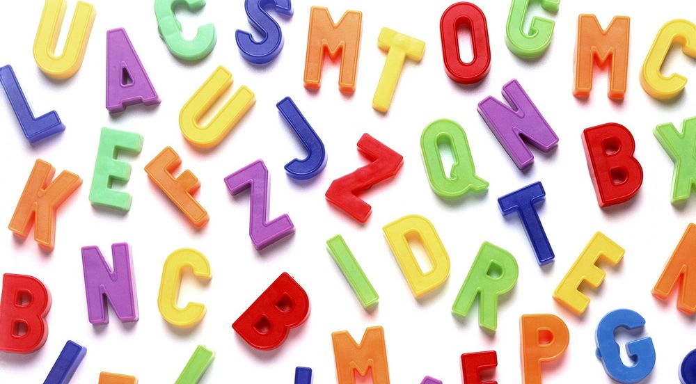 Plastic letters in many colours. Photo.