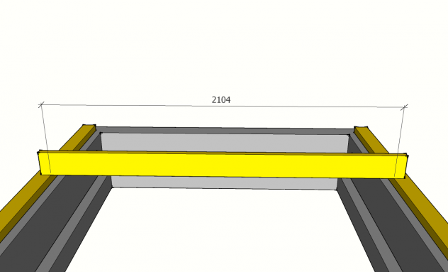 En bjelke ligger på toppen av to vegger. Foto.
