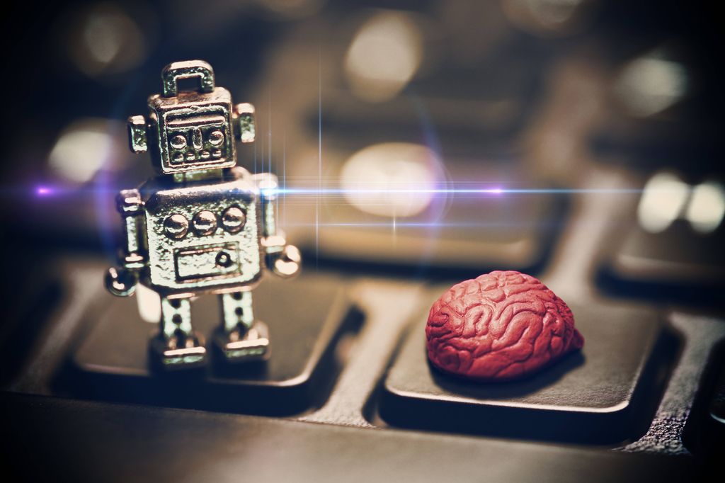 En liten robot og en menneskehjerne på et tastatur. Illustrasjon.