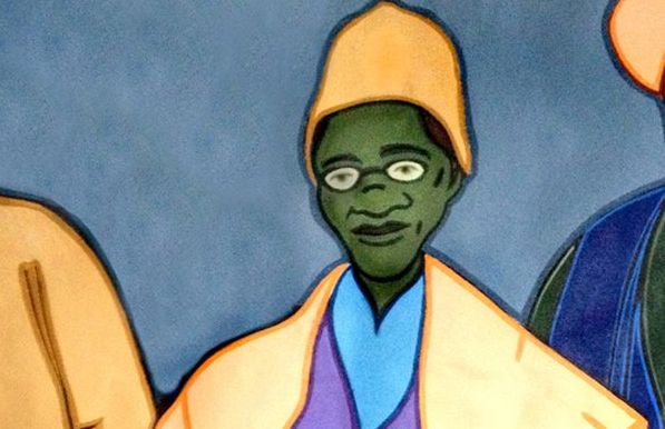 Painting: We see an older black woman with glasses, wearing a hat. Bright colours are used. The drawing is simple.