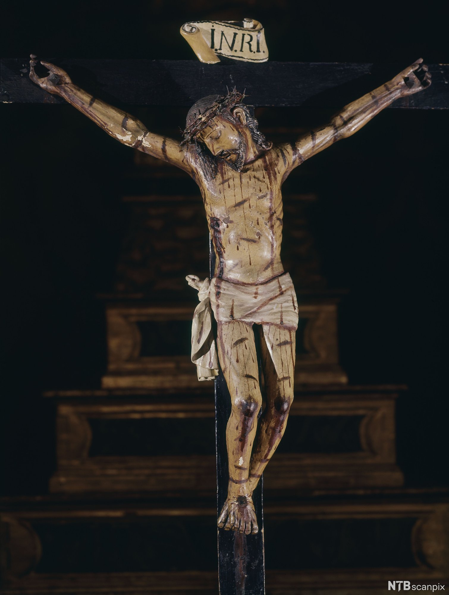 Figur som viser Jesus på korset. Kunst.