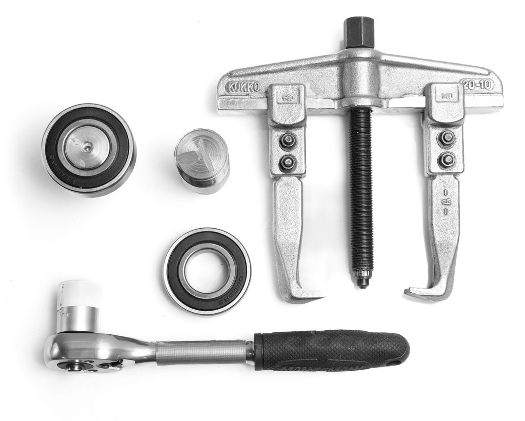 Skralle, toarma avdrager, lager og aksling. Foto.