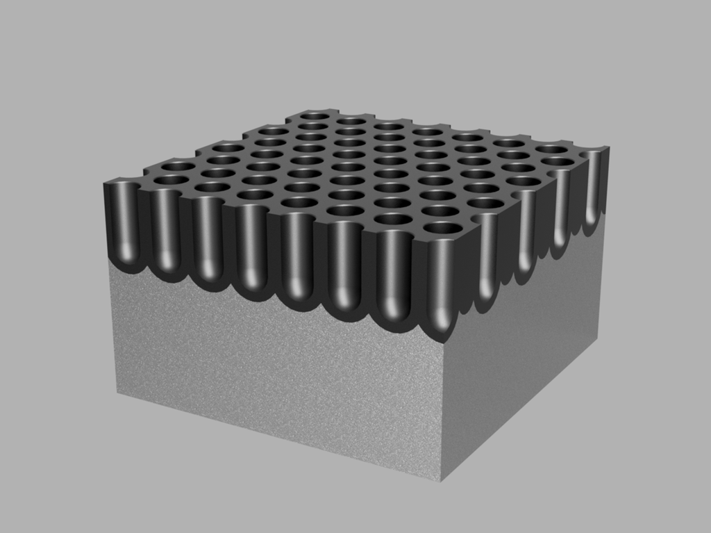 Rektangulær kloss med mange middels dype hull i overflata. Illustrasjon.